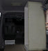 Shower cubicle fitted behind the driver's seat of a Mercedes Sprinter
