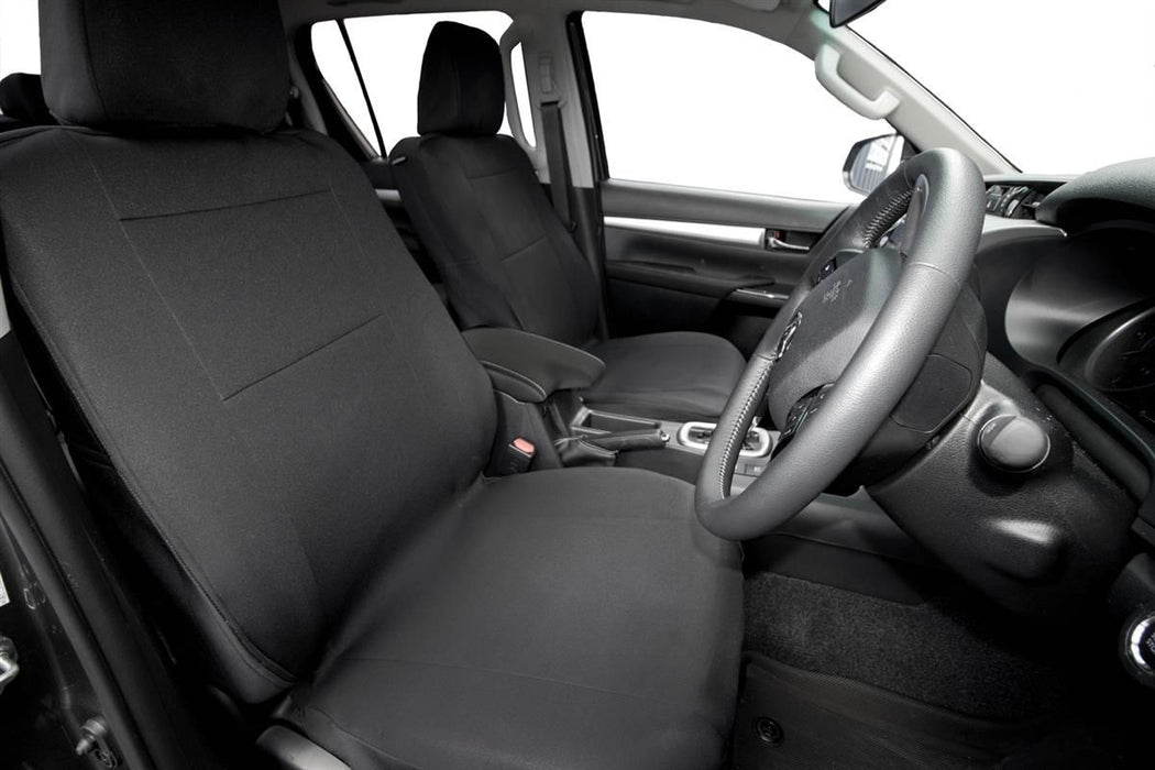 Car interior with black seat covers and steering wheel