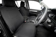 Car interior with black seat covers and steering wheel