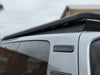 Close-up of X-Country Summit platform edge bracket and roof rail clamp on VW ID Buzz