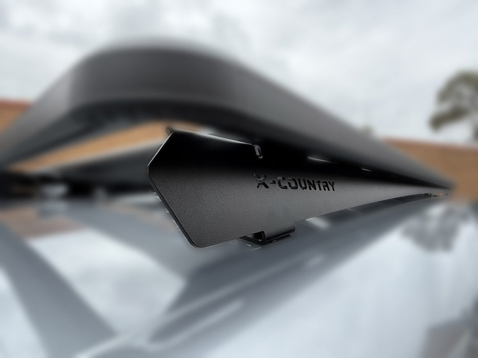 Close-up of X-Country Summit platform front mounting bracket on VW ID Buzz roof rails