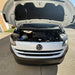 White T7 Volkswagen van with open hood on a driveway