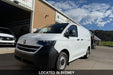 White van parked outside a building with 'Located in Sydney' text overlay