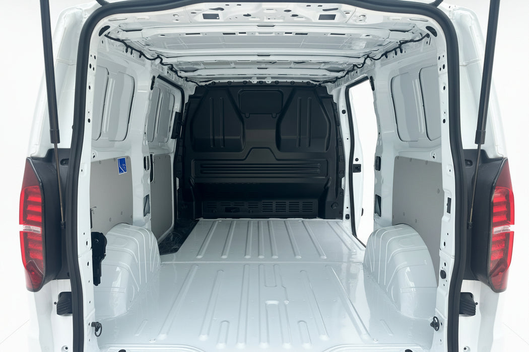 Empty white van interior with open doors