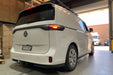 White Volkswagen ID. Buxx Cargo van parked inside a warehouse with Towbar fitted